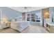 Bright bedroom with ocean view and built-in shelving at 3806 Gulf Of Mexico Dr # C211, Longboat Key, FL 34228