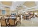 Spacious community room with tables and chairs at 3806 Gulf Of Mexico Dr # C211, Longboat Key, FL 34228
