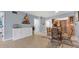 Bright dining area with a glass table and wicker chairs at 3806 Gulf Of Mexico Dr # C211, Longboat Key, FL 34228