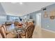 Dining area with glass top table and ocean view at 3806 Gulf Of Mexico Dr # C211, Longboat Key, FL 34228