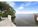 Private dock with bench overlooking calm water at 3806 Gulf Of Mexico Dr # C211, Longboat Key, FL 34228