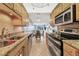 Modern kitchen with stainless steel appliances and granite countertops at 3806 Gulf Of Mexico Dr # C211, Longboat Key, FL 34228