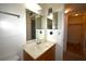 Bathroom with a vanity and mirror, access to hallway at 4315 Aegean Dr # 110C, Tampa, FL 33611