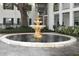 Serene courtyard fountain creating a tranquil atmosphere at 4315 Aegean Dr # 110C, Tampa, FL 33611