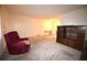 Living room features carpeted floors and a view into the dining area at 4315 Aegean Dr # 110C, Tampa, FL 33611