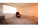 Living room with a brown leather sofa and maroon recliner at 4315 Aegean Dr # 110C, Tampa, FL 33611