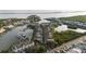 Aerial view of a waterfront community with townhouses and boat docks at 4338 Spinnaker Cove Ln, Tampa, FL 33615