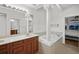 Bathroom with double vanity, soaking tub and bedroom view at 4338 Spinnaker Cove Ln, Tampa, FL 33615