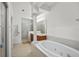 Elegant bathroom with a large soaking tub and double vanity at 4338 Spinnaker Cove Ln, Tampa, FL 33615