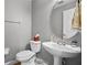 Clean and modern half bathroom with pedestal sink and toilet at 4338 Spinnaker Cove Ln, Tampa, FL 33615