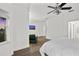 Main bedroom with a TV and additional seating area at 4338 Spinnaker Cove Ln, Tampa, FL 33615