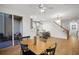 Dining area with wooden table, four chairs, and access to balcony at 4338 Spinnaker Cove Ln, Tampa, FL 33615