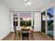 Bright dining area with wooden table and four black chairs at 4338 Spinnaker Cove Ln, Tampa, FL 33615