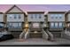 Three-story townhouses with attached garages and stairs at 4338 Spinnaker Cove Ln, Tampa, FL 33615