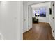 Bright hallway with hardwood floors, leading to a comfortable sitting area at 4338 Spinnaker Cove Ln, Tampa, FL 33615