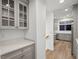 Kitchen hallway with built-in cabinets and granite countertops at 4338 Spinnaker Cove Ln, Tampa, FL 33615