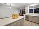 Island kitchen with granite countertop and light grey cabinets at 4338 Spinnaker Cove Ln, Tampa, FL 33615