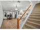View of staircase with carpeted steps and wooden railing at 4338 Spinnaker Cove Ln, Tampa, FL 33615