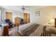 Bedroom with a queen-size bed, dresser and desk at 7400 Chairman Ct, Port Richey, FL 34668