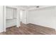 Well-lit bedroom with wood-look floors and large closet at 801 83Rd N Ave # 120, St Petersburg, FL 33702