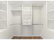 Bright walk-in closet with shelving and hanging rods at 801 83Rd N Ave # 120, St Petersburg, FL 33702
