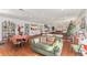 Community room with tables, chairs, and a cozy sitting area at 801 83Rd N Ave # 120, St Petersburg, FL 33702