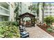 Relaxing community courtyard with covered seating area and lush landscaping at 801 83Rd N Ave # 120, St Petersburg, FL 33702