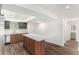 Modern kitchen with island, stainless steel appliances, and wood flooring at 801 83Rd N Ave # 120, St Petersburg, FL 33702
