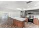 Open-concept kitchen with an island and stainless steel appliances at 801 83Rd N Ave # 120, St Petersburg, FL 33702