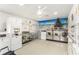 Well-equipped laundry room features multiple washers, dryers, and a vibrant tropical mural at 801 83Rd N Ave # 120, St Petersburg, FL 33702
