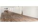 Living room with hardwood floors and kitchen and bathroom access at 801 83Rd N Ave # 120, St Petersburg, FL 33702