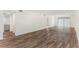 Spacious living room featuring wood-look floors and neutral walls at 801 83Rd N Ave # 120, St Petersburg, FL 33702