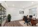 Cozy office space with ample natural light, modern desk, shelving, and stylish decor at 801 83Rd N Ave # 120, St Petersburg, FL 33702