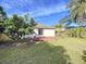 Large backyard with grassy area and patio at 8109 N Edison Ave, Tampa, FL 33604