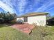 Spacious backyard with brick patio and grassy area at 8109 N Edison Ave, Tampa, FL 33604