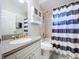 Bathroom with shower/tub and striped curtain at 8109 N Edison Ave, Tampa, FL 33604