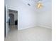Spacious bedroom with tile flooring and ceiling fan at 8109 N Edison Ave, Tampa, FL 33604