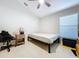 Simple bedroom with a window and ceiling fan at 8109 N Edison Ave, Tampa, FL 33604