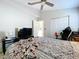 Spacious bedroom with a large bed and a gaming setup at 8109 N Edison Ave, Tampa, FL 33604