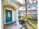 Teal front door and white columns at 8109 N Edison Ave, Tampa, FL 33604