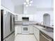 Modern kitchen with stainless steel appliances and granite countertops at 8109 N Edison Ave, Tampa, FL 33604