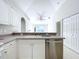 Open kitchen with stainless steel appliances and breakfast bar at 8109 N Edison Ave, Tampa, FL 33604