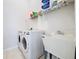 Laundry room with washer, dryer, and utility sink at 8109 N Edison Ave, Tampa, FL 33604