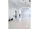 Living room with tile floors, high ceilings and a view of the kitchen at 8109 N Edison Ave, Tampa, FL 33604