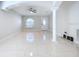 Spacious living room with tile floors and a ceiling fan at 8109 N Edison Ave, Tampa, FL 33604