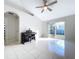 Bright and airy living room with tile floors and access to backyard at 8109 N Edison Ave, Tampa, FL 33604