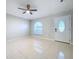 Bright living room with tile floors and a ceiling fan at 8109 N Edison Ave, Tampa, FL 33604