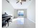 Bright living room with tile floors and sliding glass doors at 8109 N Edison Ave, Tampa, FL 33604