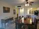 Spacious dining area with wood table and chairs, open to kitchen at 12300 Vonn Rd # 6103, Largo, FL 33774