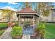 Charming gazebo surrounded by lush greenery, offering a serene outdoor retreat on the property at 1239 S Martin Luther King Jr Ave # 104, Clearwater, FL 33756